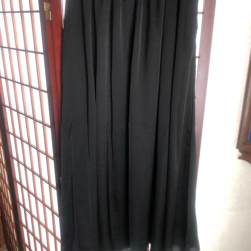 Non descript satin black skirt with belt